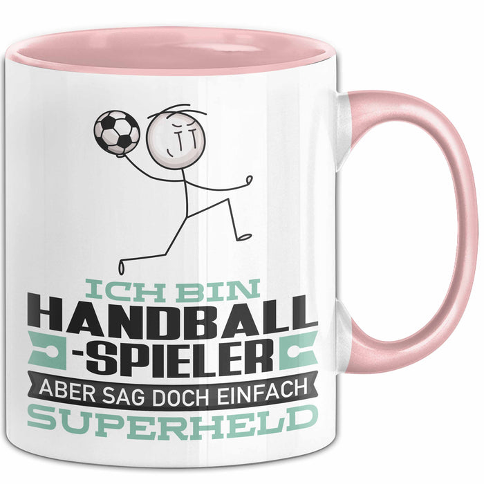 Handballspieler Geschenk Tasse Ich Bin Handballspieler Aber Sag Doch Einfach Superheld Lustige Geschenkdiee für Handballspieler Kaffee-Becher Rosa Trendation