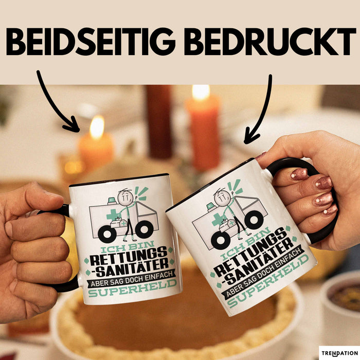 Rettungssanitäter Geschenk Tasse Ich Bin Rettungssanitäter Aber Sag Doch Einfach Superheld Lustige Geschenkdiee für Rettungssanitäter Kaffee-Becher Schwarz Trendation