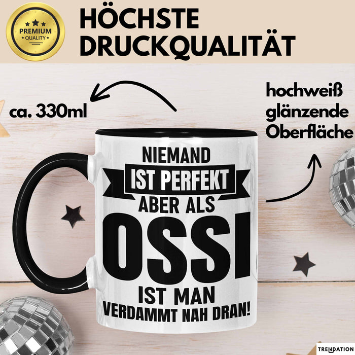 Ossi Geschenk Tasse Ostdeutschland Ossi Geschenkidee Niemand Ist Perfekt Aber Als Ossi Ist Man Verdammt Nah Dran Dresden Leipzig Kaffee-Becher Schwarz Trendation