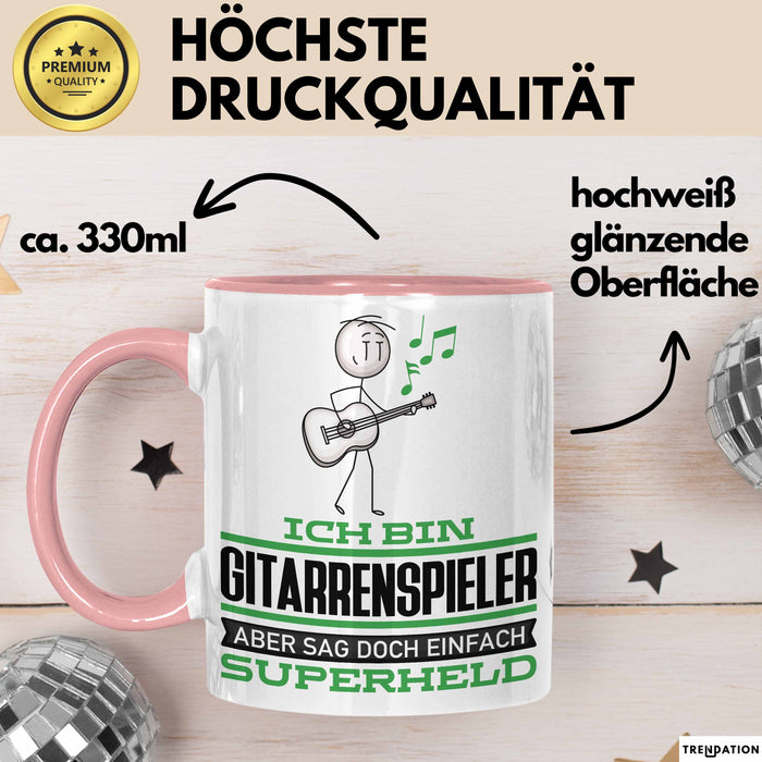 Gitarrenspieler Geschenk Tasse Ich Bin Gitarrenspieler Aber Sag Doch Einfach Superheld Lustige Geschenkdiee für Gitarrenspieler Kaffee-Becher Rosa Trendation