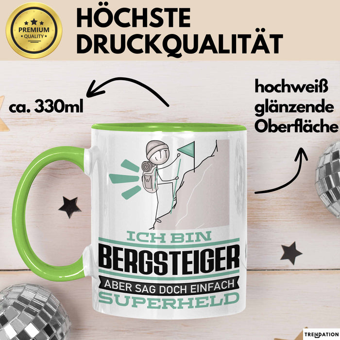 Bergsteiger Geschenk Tasse Ich Bin Bergsteiger Aber Sag Doch Einfach Superheld Lustige Geschenkdiee für Bergsteiger Kaffee-Becher Grün Trendation