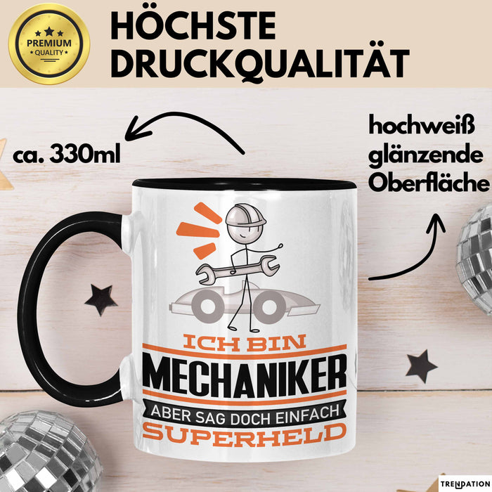 Mechaniker Geschenk Tasse Ich Bin Mechaniker Aber Sag Doch Einfach Superheld Lustige Geschenkdiee für Mechaniker Kaffee-Becher Schwarz Trendation