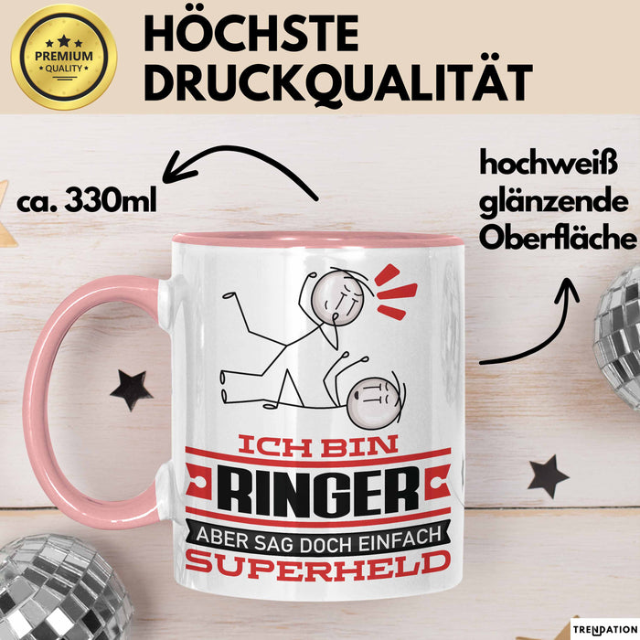 Ringer Geschenk Tasse Ich Bin Ringer Aber Sag Doch Einfach Superheld Lustige Geschenkdiee für Ringer Kaffee-Becher Rosa Trendation