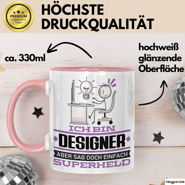 Designer Geschenk Tasse Ich Bin Designer Aber Sag Doch Einfach Superheld Lustige Geschenkdiee für Designer Kaffee-Becher Rosa Trendation