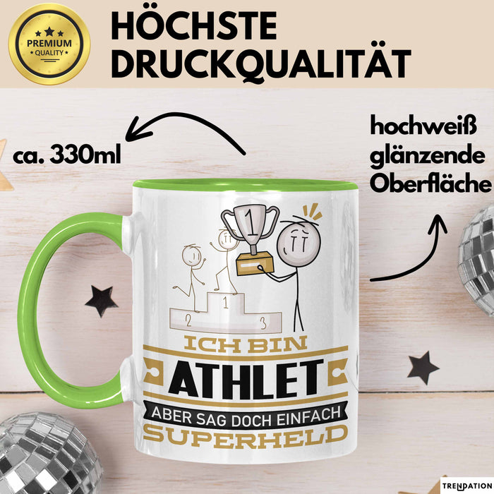 Athlet Geschenk Tasse Ich Bin Athlet Aber Sag Doch Einfach Superheld Lustige Geschenkdiee für Athlet Kaffee-Becher Grün Trendation