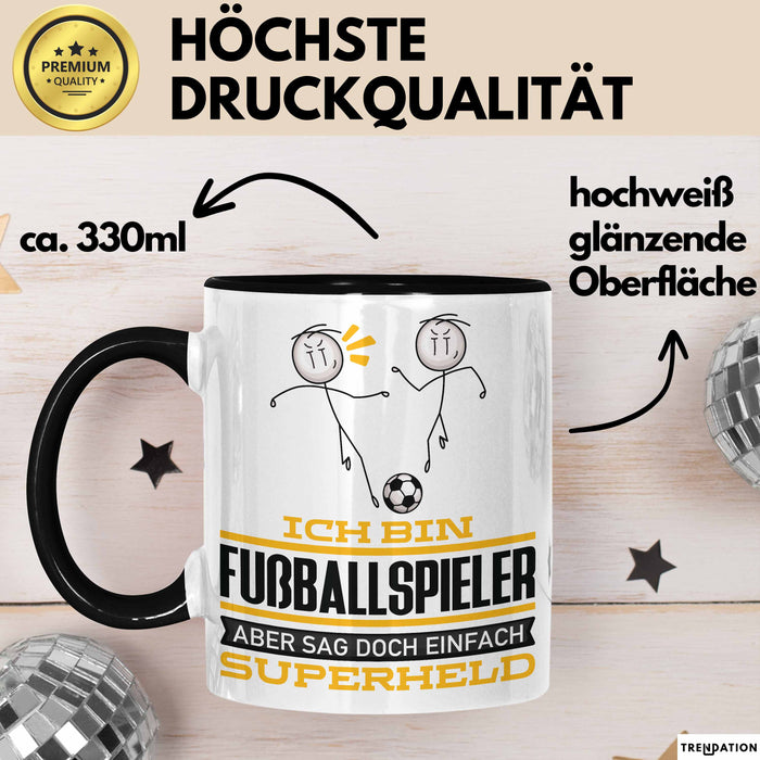 Fußballspieler Geschenk Tasse Ich Bin Fußballspieler Aber Sag Doch Einfach Superheld Lustige Geschenkdiee für Fußballspieler Kaffee-Becher Schwarz Trendation