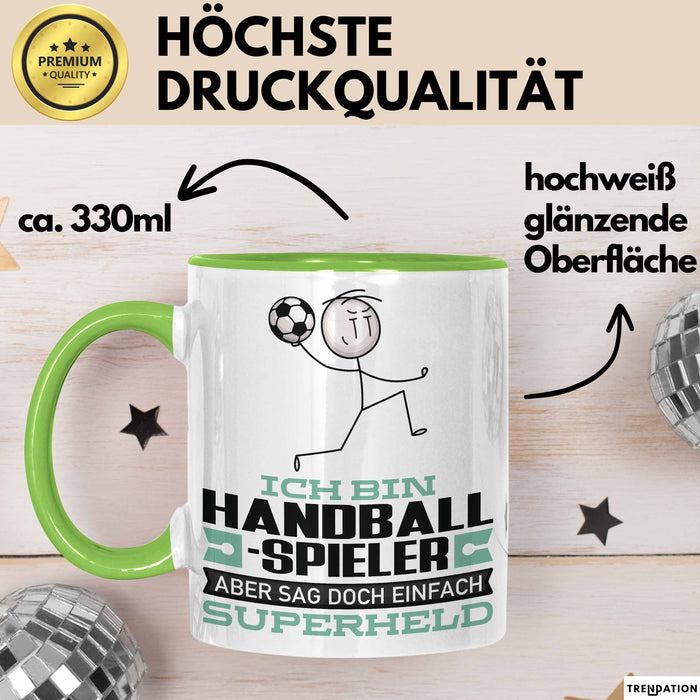 Handballspieler Geschenk Tasse Ich Bin Handballspieler Aber Sag Doch Einfach Superheld Lustige Geschenkdiee für Handballspieler Kaffee-Becher Grün Trendation