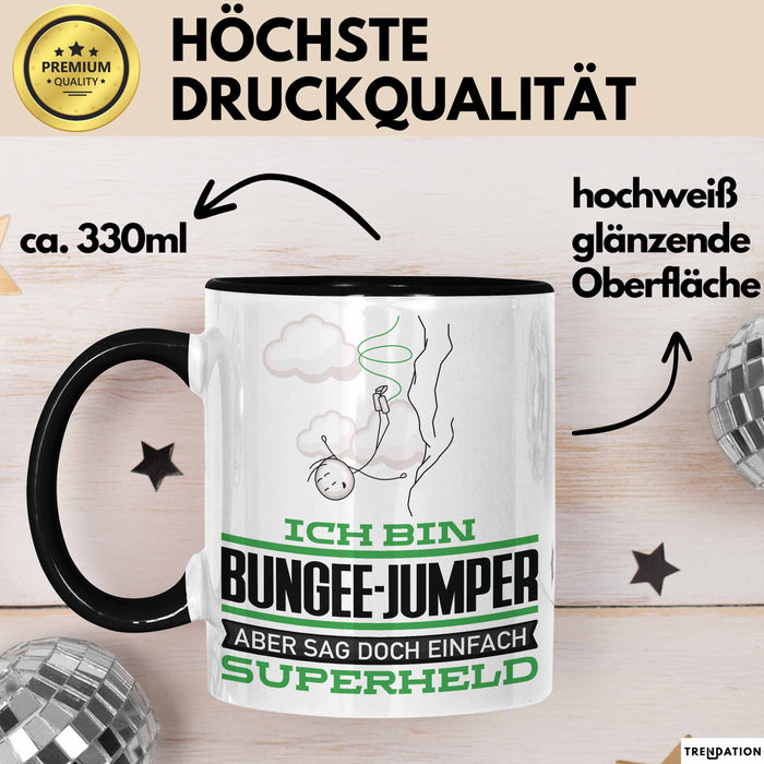 Bungee-Jumper Geschenk Tasse Ich Bin Bungee-Jumper Aber Sag Doch Einfach Superheld Lustige Geschenkdiee für Bungee-Jumper Kaffee-Becher Schwarz Trendation