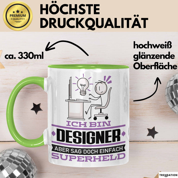 Designer Geschenk Tasse Ich Bin Designer Aber Sag Doch Einfach Superheld Lustige Geschenkdiee für Designer Kaffee-Becher Grün Trendation