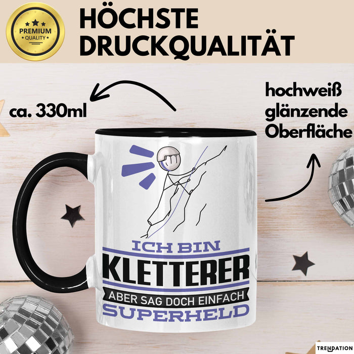 Kletterer Geschenk Tasse Ich Bin Kletterer Aber Sag Doch Einfach Superheld Lustige Geschenkdiee für Kletterer Kaffee-Becher Schwarz Trendation