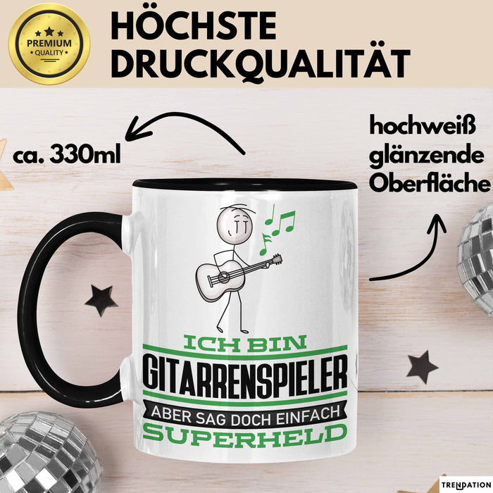 Gitarrenspieler Geschenk Tasse Ich Bin Gitarrenspieler Aber Sag Doch Einfach Superheld Lustige Geschenkdiee für Gitarrenspieler Kaffee-Becher Schwarz Trendation