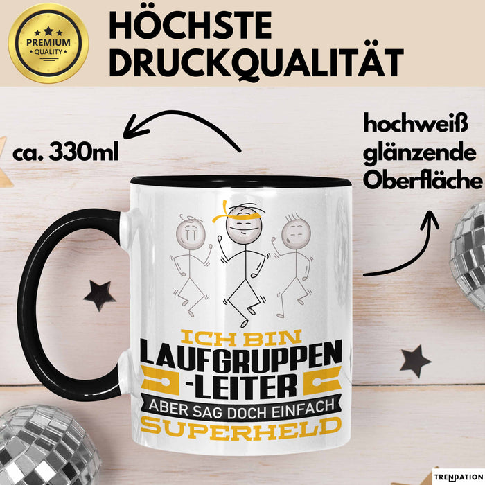 Laufgruppenleiter Geschenk Tasse Ich Bin Laufgruppenleiter Aber Sag Doch Einfach Superheld Lustige Geschenkdiee für Laufgruppenleiter Kaffee-Becher Schwarz Trendation