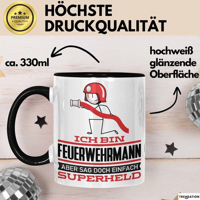 Feuerwehrmann Geschenk Tasse Ich Bin Feuerwehrmann Aber Sag Doch Einfach Superheld Lustige Geschenkdiee für Feuerwehrmann Kaffee-Becher Schwarz Trendation