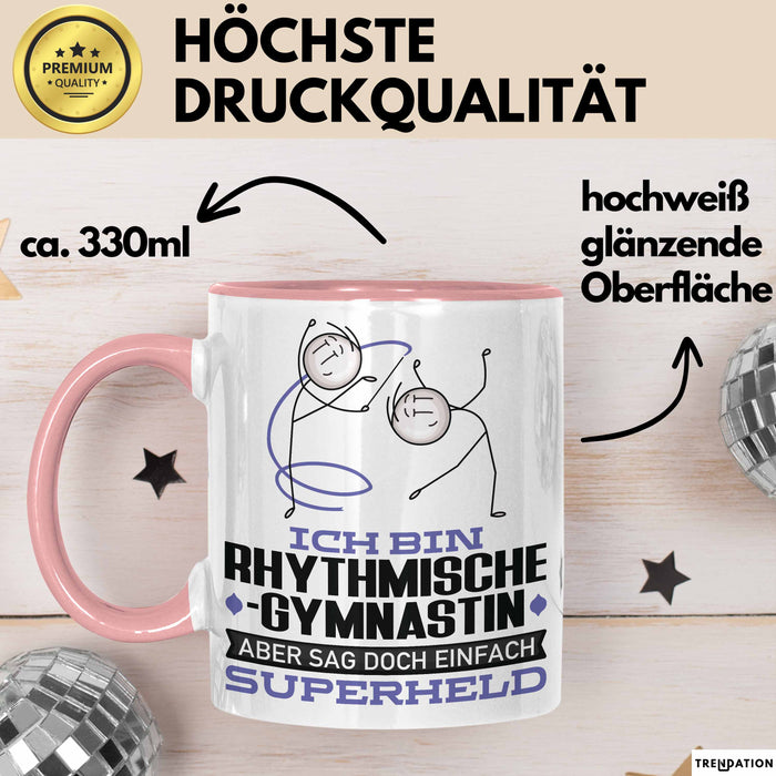 RhythmischeGymnastin Geschenk Tasse Ich Bin RhythmischeGymnastin Aber Sag Doch Einfach Superheld Lustige Geschenkdiee für RhythmischeGymnastin Kaffee-Becher Rosa Trendation