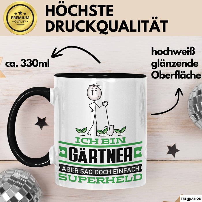 Gärtner Geschenk Tasse Ich Bin Gärtner Aber Sag Doch Einfach Superheld Lustige Geschenkdiee für Gärtner Kaffee-Becher Schwarz Trendation