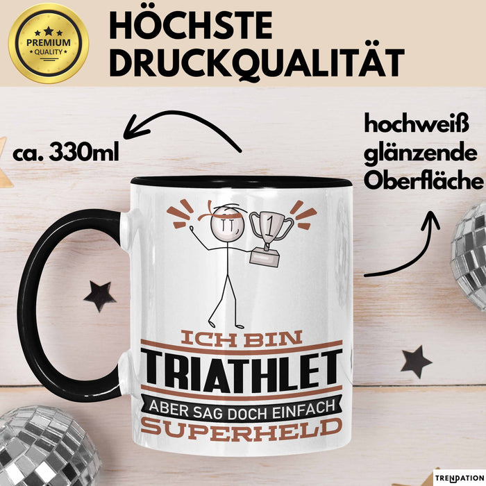 Triathlet Geschenk Tasse Ich Bin Triathlet Aber Sag Doch Einfach Superheld Lustige Geschenkdiee für Triathlet Kaffee-Becher Schwarz Trendation