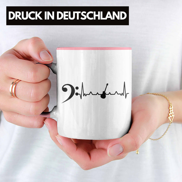 Bassist Tasse Geschenk Bass-Spieler Geschenkidee Kaffee-Becher Herzschlag Rosa Trendation